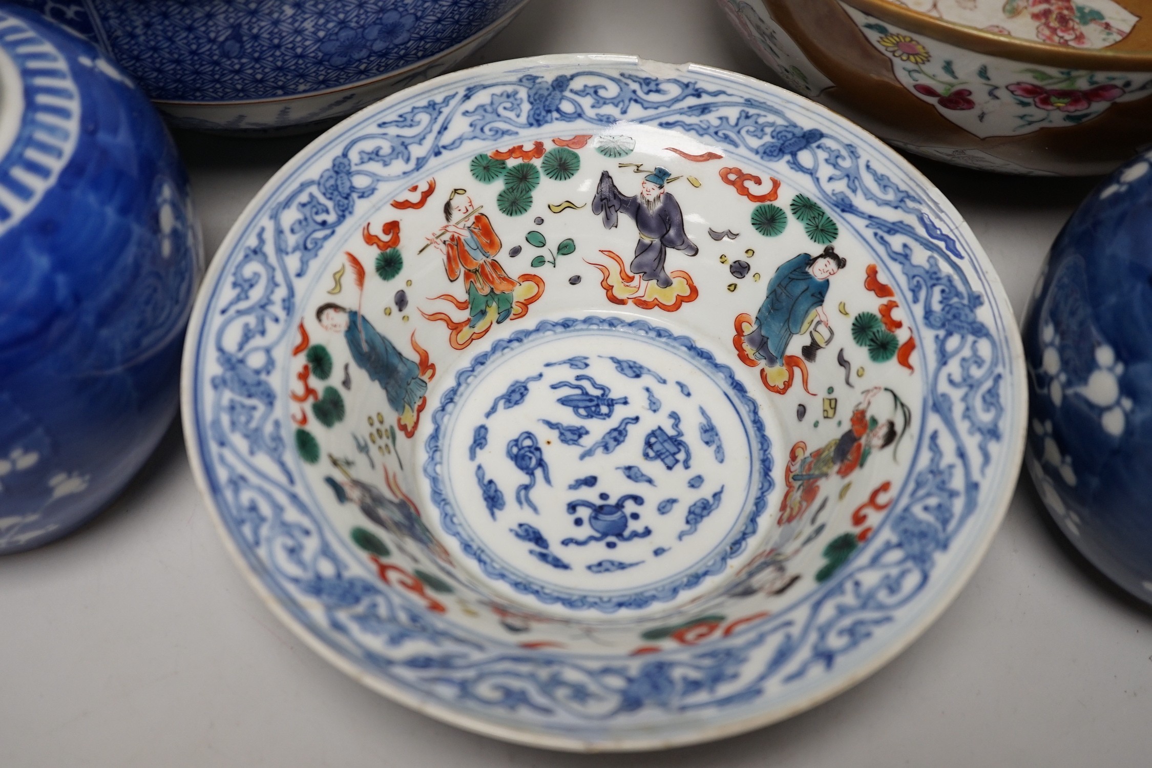 A group of Japanese and Chinese ceramics to include two blue and white jars, a wucai bowl etc.